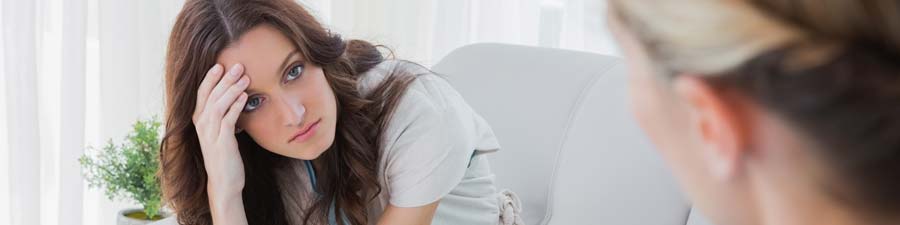 student talking to psychiatrist about her addiction