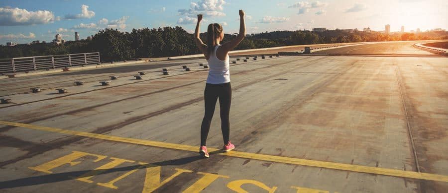 woman finishing the race