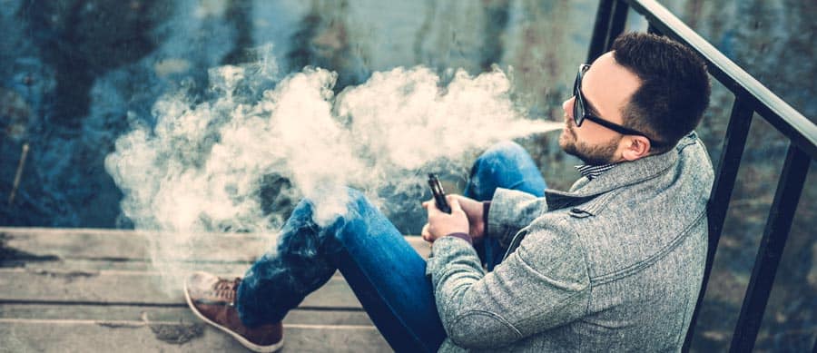 man vaping outside